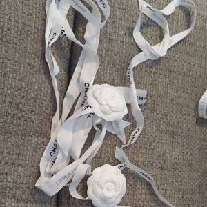CHANEL White Ribbon with Floral Accents